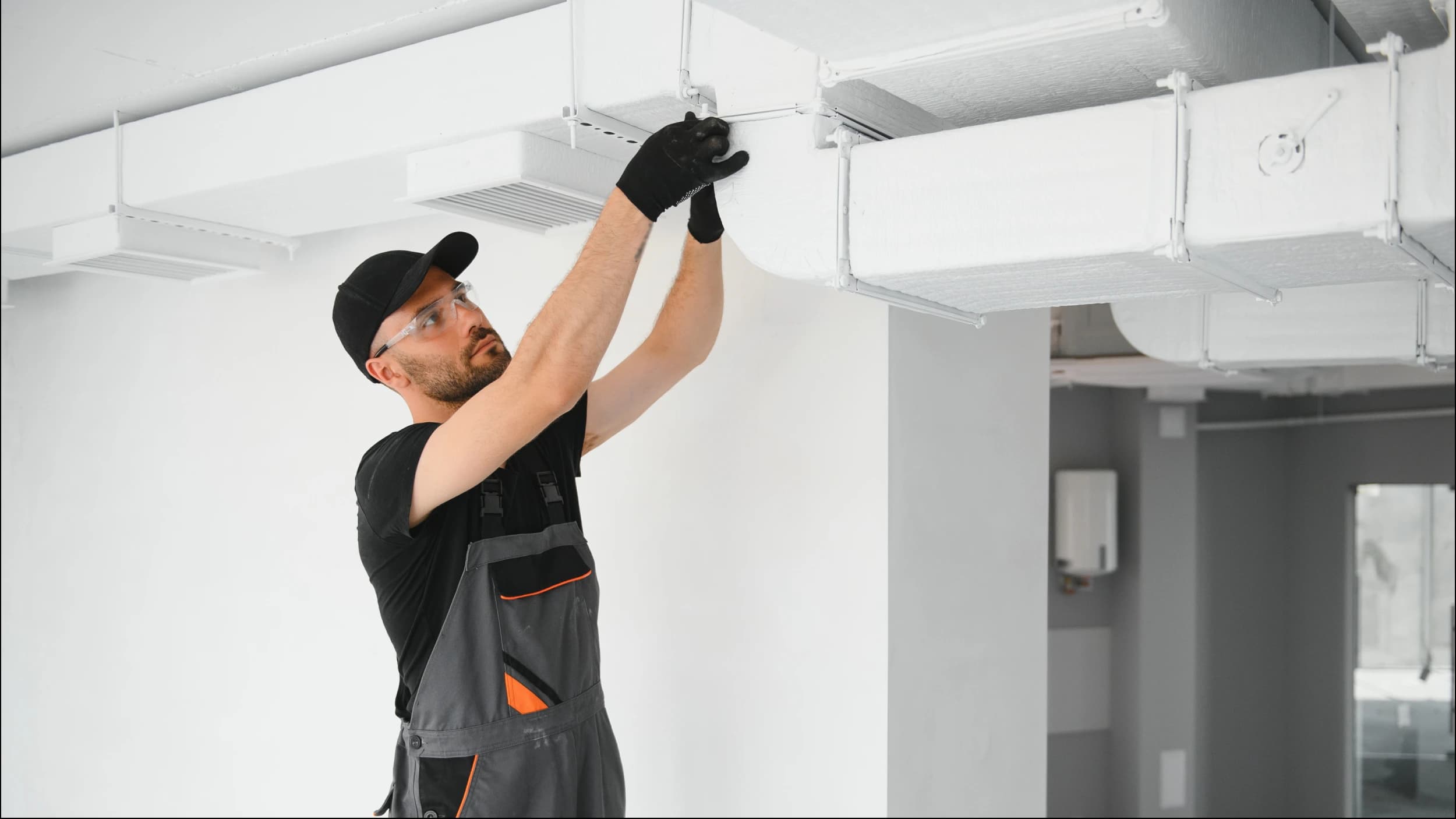 HVAC technician working on unit in Toronto